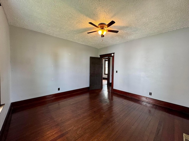 940 W 3rd St, Logan, OH 43138 - unfurnished room featuring a textured ceiling, dark wood-style floors, and ceiling fan