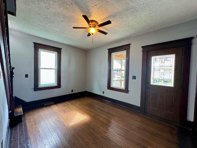 940 W 3rd St, Logan, OH 43138 - entryway with dark wood-style floors, a ceiling fan, and a textured ceiling