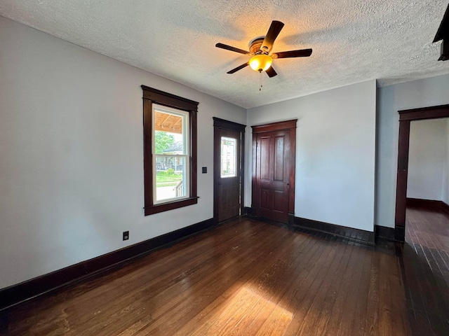 940 W 3rd St, Logan, OH 43138 - entryway with dark wood-type flooring, a textured ceiling, and a ceiling fan