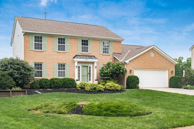 2063 Hayer Ct, Lewis Center, OH 43035 - colonial inspired home featuring brick siding, a garage, driveway, a front lawn, and a shingled roof