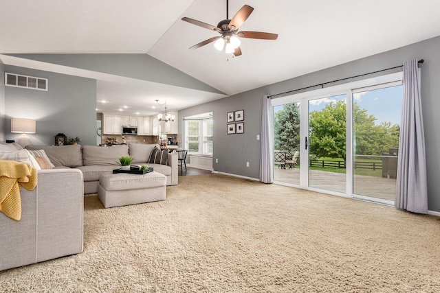 2063 Hayer Ct, Lewis Center, OH 43035 - living area featuring a chandelier, a ceiling fan, lofted ceiling, and light carpet