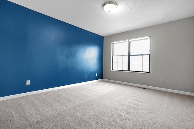 920 Charnwood Ln Unit 10A, Columbus, OH 43085 - carpeted spare room featuring baseboards and a textured ceiling