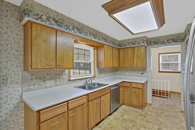 19 Kirby Rd, Heath, OH 43056 - kitchen with appliances with stainless steel finishes, light countertops, wallpapered walls, healthy amount of natural light, and brown cabinetry