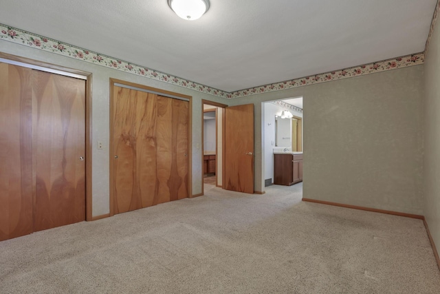 19 Kirby Rd, Heath, OH 43056 - unfurnished bedroom with two closets, carpet flooring, and ensuite bath
