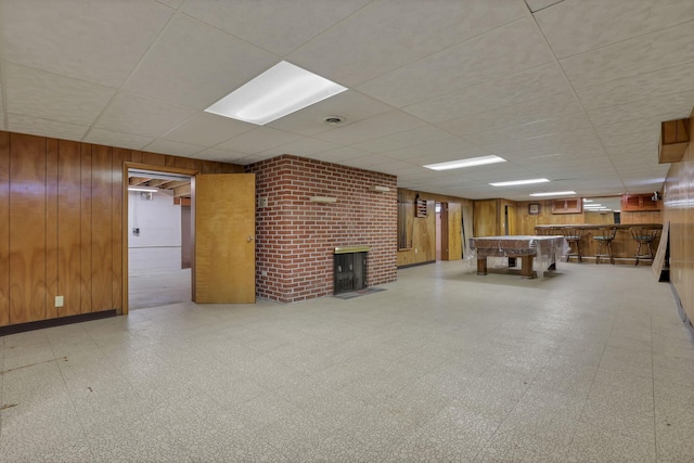 19 Kirby Rd, Heath, OH 43056 - finished basement with a paneled ceiling, wooden walls, tile patterned floors, a fireplace, and bar area