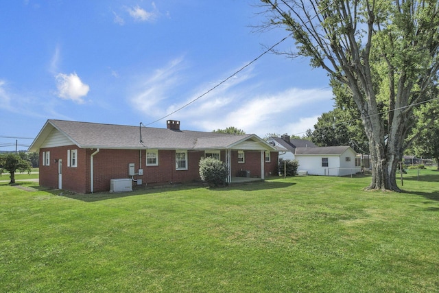 19 Kirby Rd, Heath, OH 43056 - rear view of property with brick siding and a yard