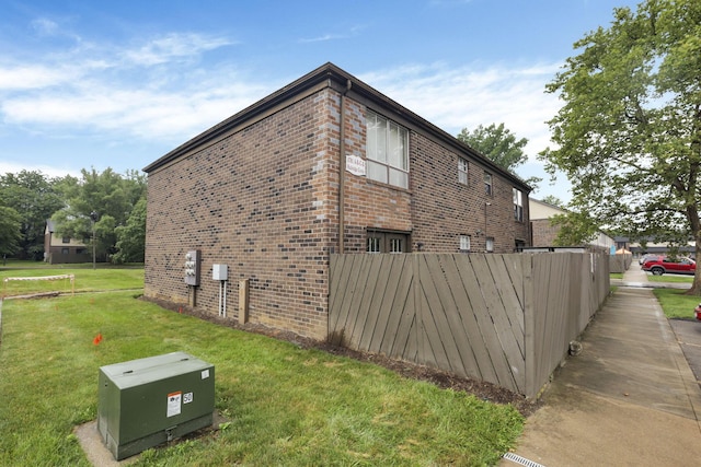 5781 Hallridge Cir Unit B, Columbus, OH 43232 - view of property exterior featuring brick siding and a yard