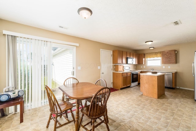 7787 Freesia St Unit 216, Blacklick, OH 43004 - dining area featuring baseboards