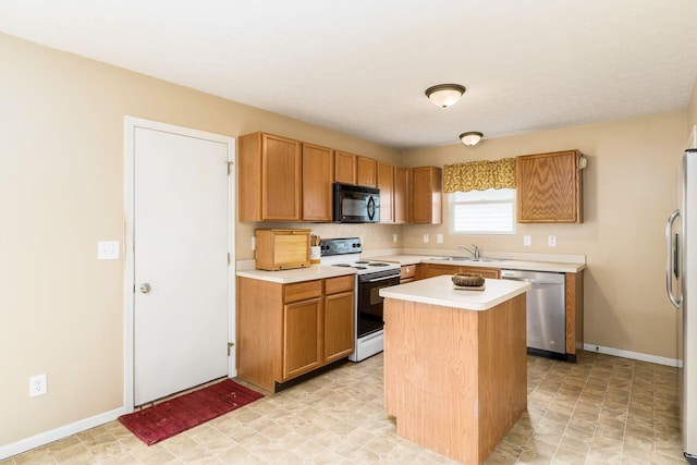 7787 Freesia St Unit 216, Blacklick, OH 43004 - kitchen with white electric range, black microwave, stainless steel dishwasher, light countertops, and a kitchen island