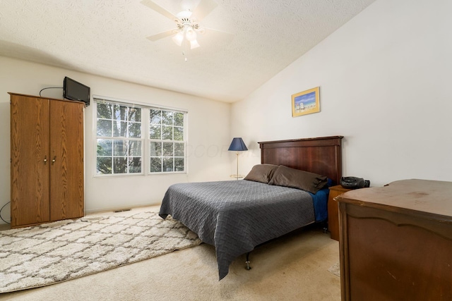 7787 Freesia St Unit 216, Blacklick, OH 43004 - bedroom with lofted ceiling, a textured ceiling, carpet, and a ceiling fan