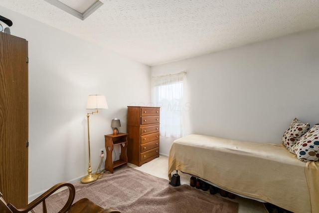7787 Freesia St Unit 216, Blacklick, OH 43004 - bedroom featuring light carpet and a textured ceiling