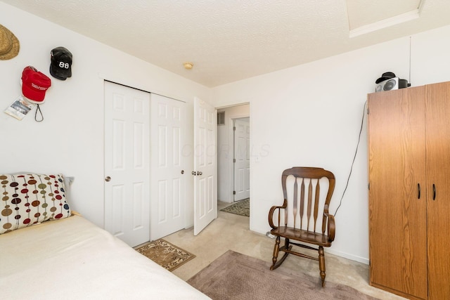7787 Freesia St Unit 216, Blacklick, OH 43004 - bedroom featuring light colored carpet, a closet, and a textured ceiling