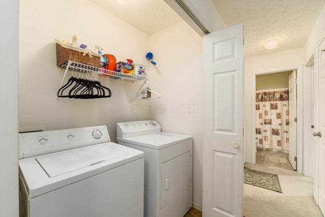 7787 Freesia St Unit 216, Blacklick, OH 43004 - laundry area featuring washer and dryer and a textured ceiling