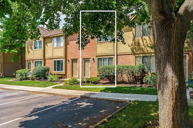 6447 Cranston Way Unit 19, Dublin, OH 43017 - multi unit property featuring uncovered parking, stucco siding, and brick siding
