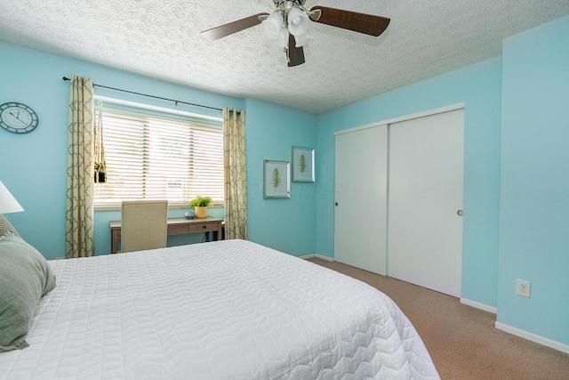 6447 Cranston Way Unit 19, Dublin, OH 43017 - bedroom with a textured ceiling, a closet, carpet flooring, and ceiling fan