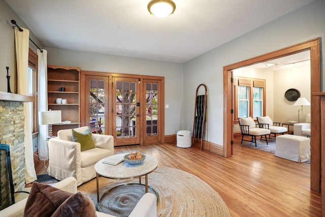 41 Northmoor Pl, Columbus, OH 43214 - living room with light wood-style flooring and a stone fireplace