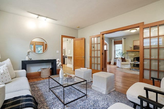 41 Northmoor Pl, Columbus, OH 43214 - living room with a stone fireplace, wood finished floors, and track lighting
