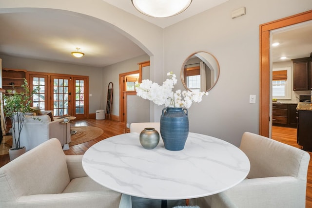 41 Northmoor Pl, Columbus, OH 43214 - dining space featuring arched walkways, light wood-style floors, and french doors