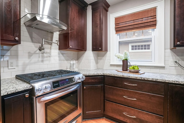 41 Northmoor Pl, Columbus, OH 43214 - kitchen with gas range, wall chimney exhaust hood, backsplash, light stone counters, and dark brown cabinets
