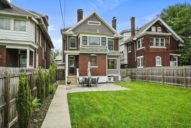 1867 Bryden Rd, Columbus, OH 43205 - back of property with a fenced backyard, brick siding, a patio, and a chimney