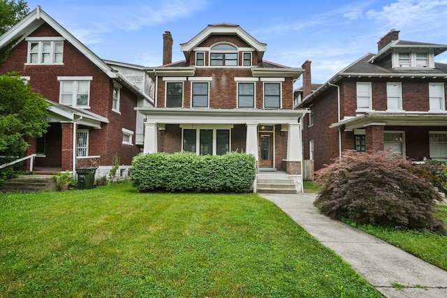 1867 Bryden Rd, Columbus, OH 43205 - american foursquare style home with brick siding, a porch, and a front yard