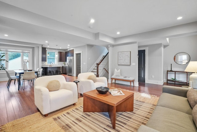 1867 Bryden Rd, Columbus, OH 43205 - living room with stairs, light wood-style floors, and recessed lighting