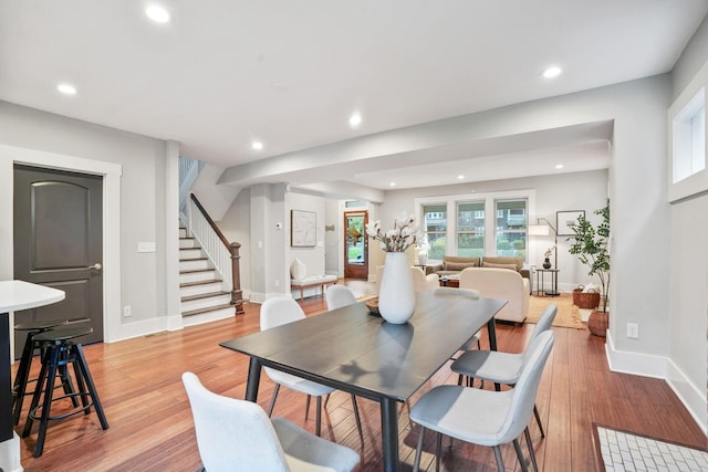 1867 Bryden Rd, Columbus, OH 43205 - dining space with stairway, light wood-style floors, and recessed lighting