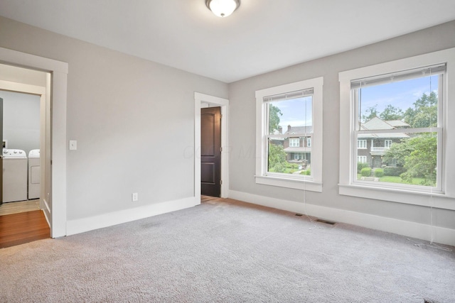 1867 Bryden Rd, Columbus, OH 43205 - carpeted empty room with washer and dryer and baseboards