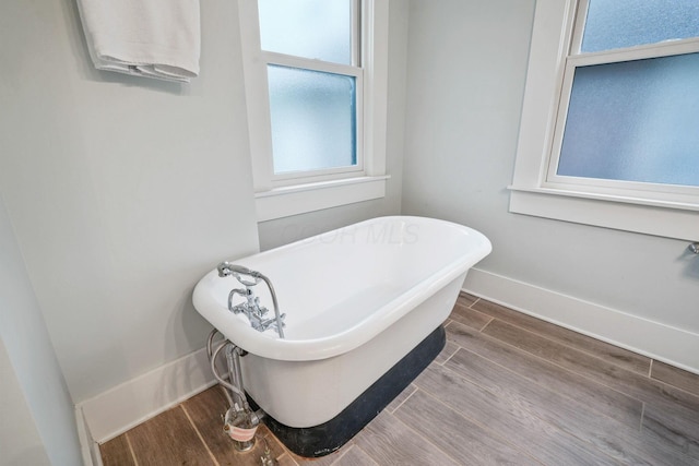 1867 Bryden Rd, Columbus, OH 43205 - full bathroom with a soaking tub and wood finished floors