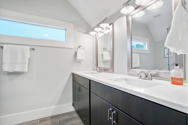 1867 Bryden Rd, Columbus, OH 43205 - full bath with vaulted ceiling, double vanity, and wood finished floors