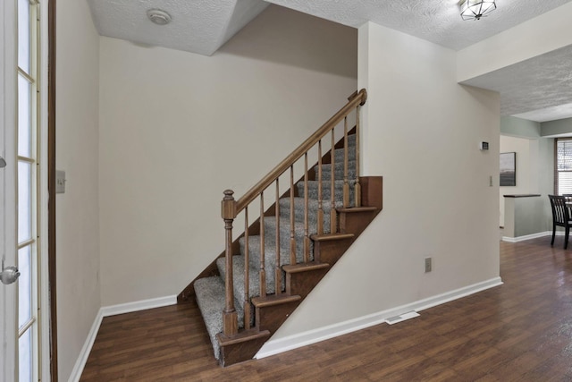 6464 Blackhaw Dr, Reynoldsburg, OH 43068 - staircase with a textured ceiling and wood finished floors