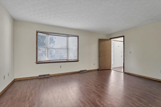 6464 Blackhaw Dr, Reynoldsburg, OH 43068 - unfurnished room featuring wood finished floors and a textured ceiling