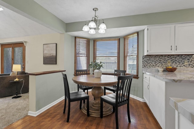 6464 Blackhaw Dr, Reynoldsburg, OH 43068 - dining space featuring dark wood-type flooring, a chandelier, and a textured ceiling