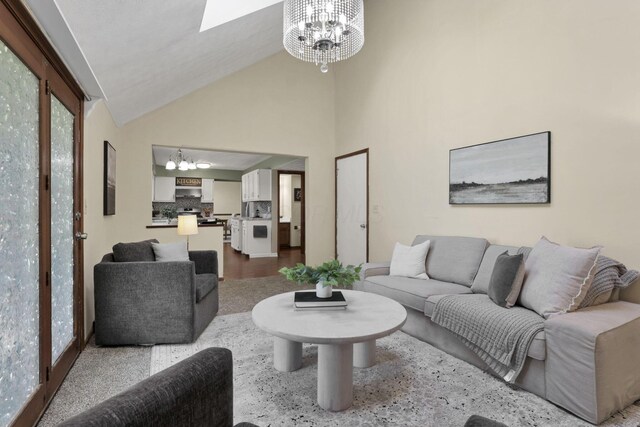 6464 Blackhaw Dr, Reynoldsburg, OH 43068 - living area with a chandelier, a skylight, and high vaulted ceiling