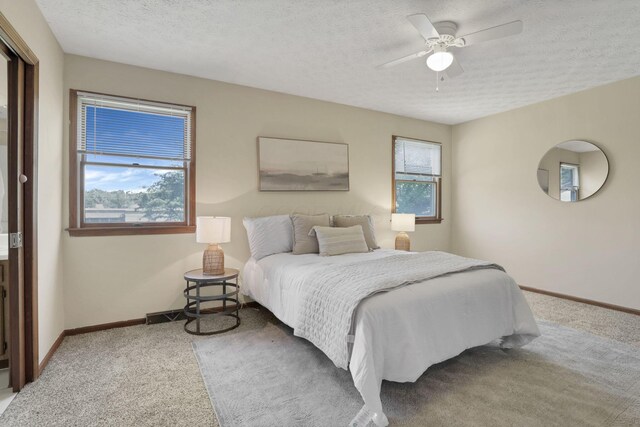 6464 Blackhaw Dr, Reynoldsburg, OH 43068 - bedroom with carpet flooring, a textured ceiling, and ceiling fan