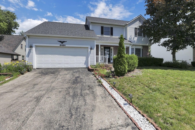 6464 Blackhaw Dr, Reynoldsburg, OH 43068 - traditional-style house with driveway, a front lawn, an attached garage, and roof with shingles