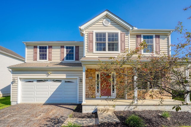 5700 Boucher Dr, Orient, OH 43146 - traditional home featuring an attached garage, driveway, and stone siding