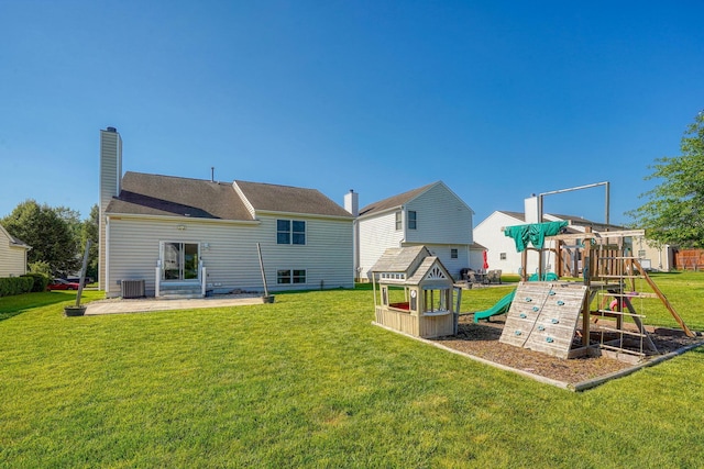 5700 Boucher Dr, Orient, OH 43146 - rear view of property with a playground, a yard, a patio, and a chimney