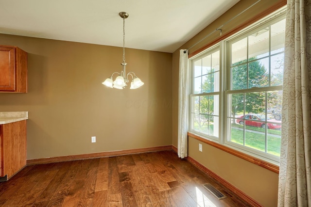 5700 Boucher Dr, Orient, OH 43146 - unfurnished dining area featuring dark wood-type flooring and a chandelier