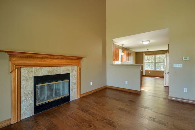 5700 Boucher Dr, Orient, OH 43146 - unfurnished living room with dark wood-style floors and a tile fireplace