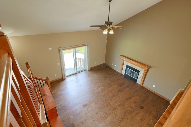 5700 Boucher Dr, Orient, OH 43146 - unfurnished living room with wood finished floors, ceiling fan, vaulted ceiling, and a tile fireplace