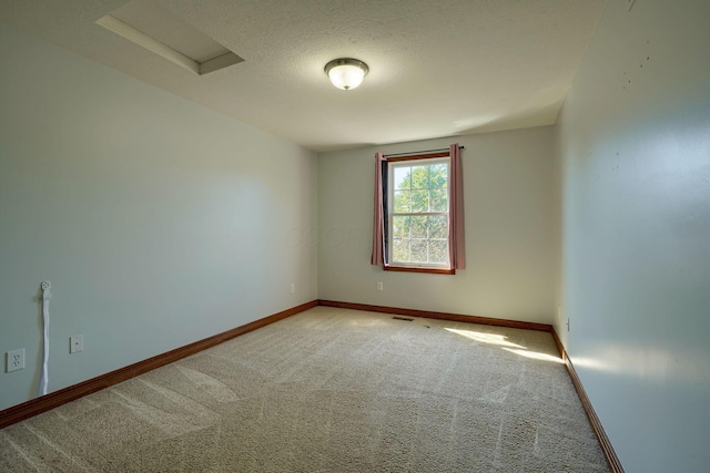 5700 Boucher Dr, Orient, OH 43146 - empty room with carpet, attic access, and a textured ceiling