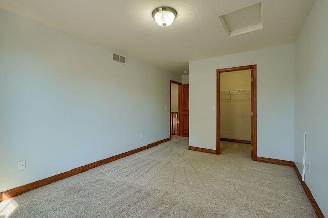 5700 Boucher Dr, Orient, OH 43146 - unfurnished bedroom featuring light colored carpet, a closet, a spacious closet, and attic access