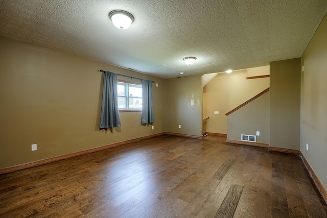5700 Boucher Dr, Orient, OH 43146 - unfurnished room featuring wood finished floors, stairs, and a textured ceiling