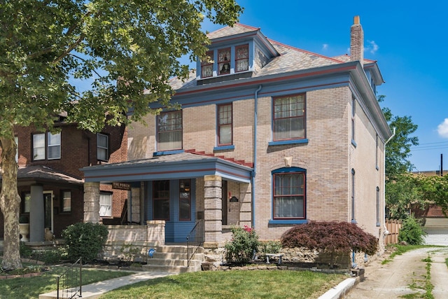 1412 Bryden Rd, Columbus, OH 43205 - american foursquare style home featuring a chimney, brick siding, and covered porch