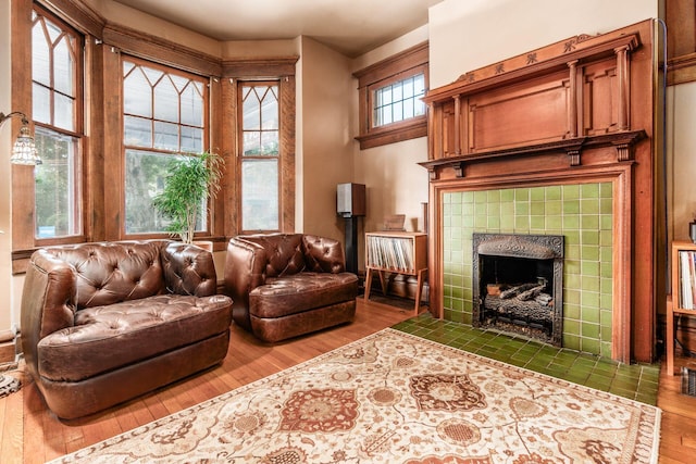 1412 Bryden Rd, Columbus, OH 43205 - living area with wood finished floors and a tile fireplace