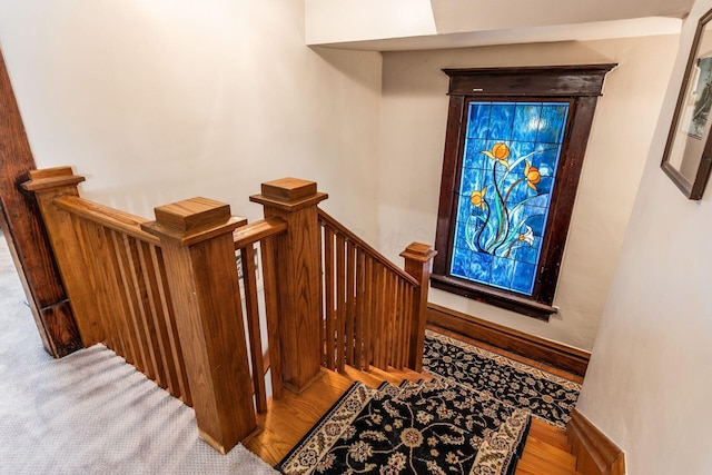1412 Bryden Rd, Columbus, OH 43205 - staircase featuring baseboards and wood finished floors