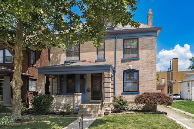 1412 Bryden Rd, Columbus, OH 43205 - view of front facade with brick siding, covered porch, and a chimney