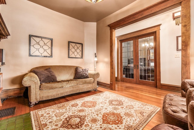 1412 Bryden Rd, Columbus, OH 43205 - living room with wood finished floors and french doors