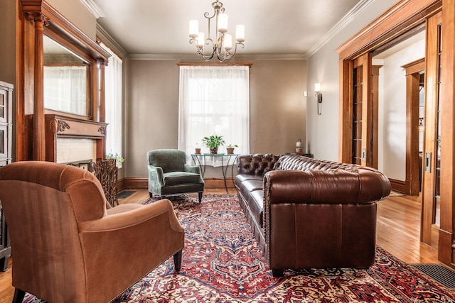 1412 Bryden Rd, Columbus, OH 43205 - living room with wood finished floors, a chandelier, and ornamental molding
